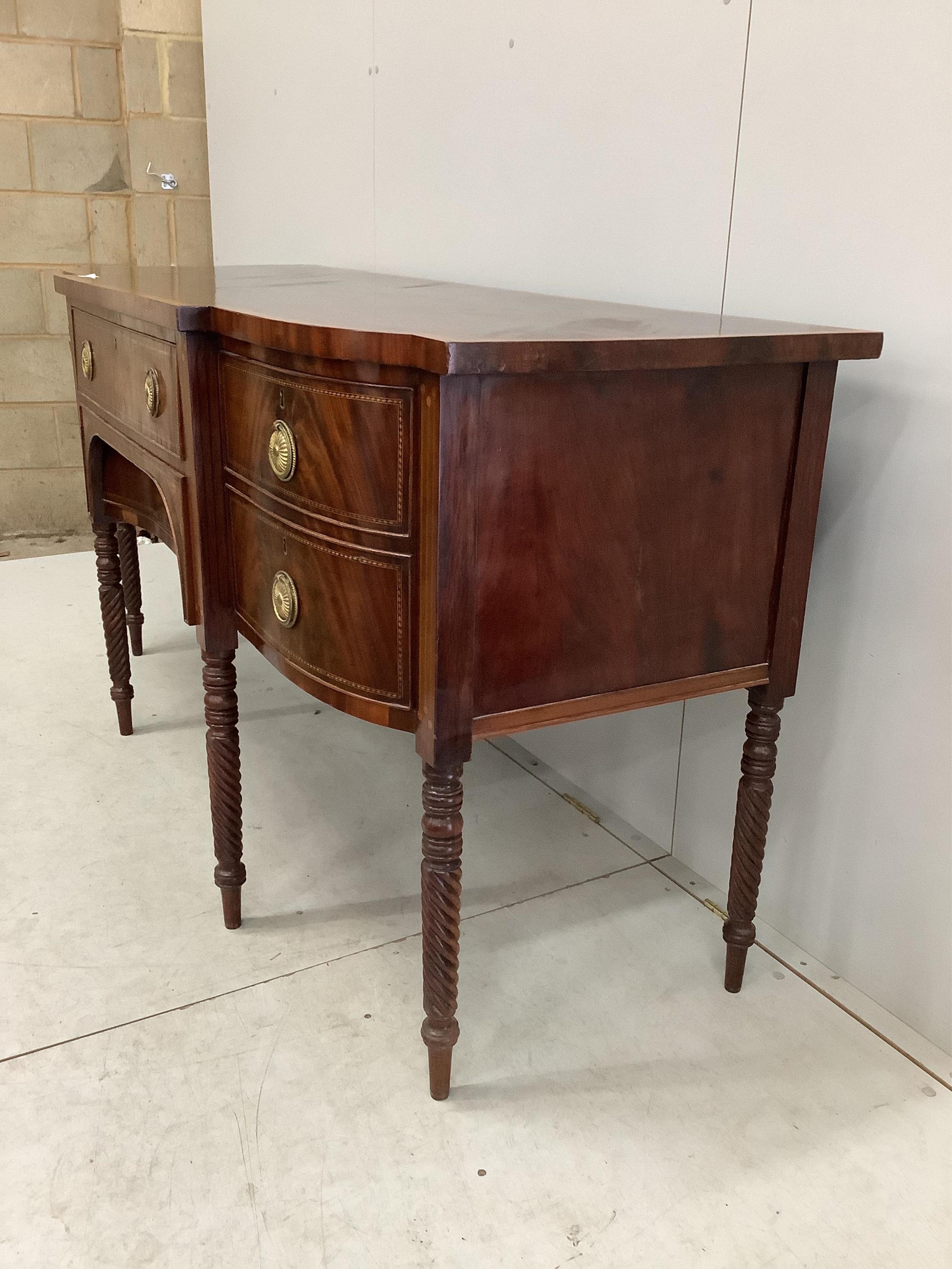 A George IV satinwood banded mahogany breakfront sideboard, width 184cm, depth 70cm, height 92cm. Condition - good